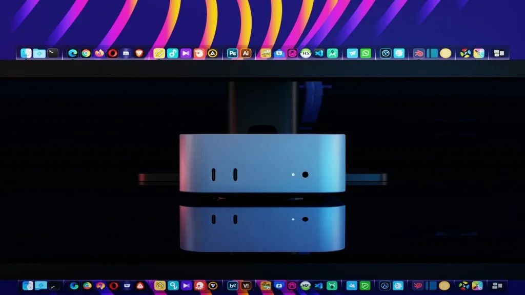 MiniPC prateado refletido em mesa preta com tela mostrando dock de aplicativos e iluminação vibrante.